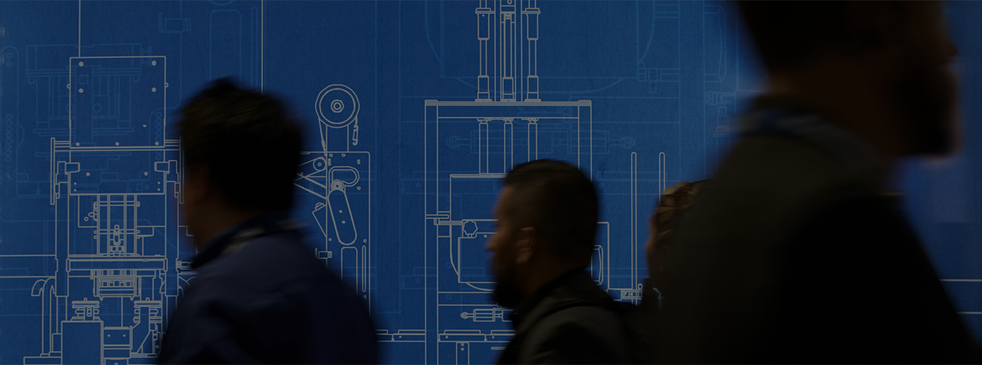 Crowd of people walking by a blue print of an invention.